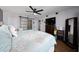Bright bedroom featuring stylish decor, a sliding door closet, and a ceiling fan at 402 Ohio Way, Kissimmee, FL 34759