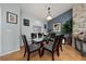 Charming dining room featuring a glass table, six chairs, and decorative accents at 402 Ohio Way, Kissimmee, FL 34759