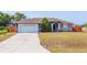 Well-maintained single-Gathering home with a two-car garage and mature landscaping at 402 Ohio Way, Kissimmee, FL 34759