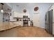 Well-lit kitchen with granite counters, stainless steel appliances, and ample cabinet space at 402 Ohio Way, Kissimmee, FL 34759