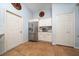 Bright kitchen featuring stainless steel appliances, white cabinetry, and convenient storage at 402 Ohio Way, Kissimmee, FL 34759