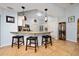 Bright kitchen boasts granite countertops, an island with stools, and plenty of storage at 402 Ohio Way, Kissimmee, FL 34759