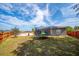 This backyard includes a trampoline perfect for active outdoor entertainment at 402 Ohio Way, Kissimmee, FL 34759