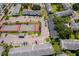 A community aerial view showcasing building exteriors, green spaces, parking, playground, and tennis courts at 4403 S Semoran Blvd # 2, Orlando, FL 32822