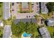 An aerial view of a community showcasing building exteriors, parking, playground, and tennis courts at 4403 S Semoran Blvd # 2, Orlando, FL 32822