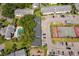 A community aerial view showcasing building exteriors, parking, playground, tennis courts, and pool at 4403 S Semoran Blvd # 2, Orlando, FL 32822