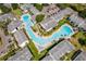 An aerial view of a community with a winding pool and well manicured green spaces at 4403 S Semoran Blvd # 2, Orlando, FL 32822