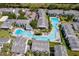 An aerial view showcasing a large community pool surrounded by well-maintained condominium buildings at 4403 S Semoran Blvd # 2, Orlando, FL 32822