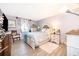 Charming bedroom with neutral walls, wood-look floors, and comfortable decor at 4403 S Semoran Blvd # 2, Orlando, FL 32822