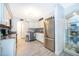 Bright kitchen featuring white cabinets, modern stainless appliances, and stylish decor at 4403 S Semoran Blvd # 2, Orlando, FL 32822