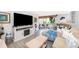 Comfortable living room with stylish furnishings, entertainment center, and sliding glass doors to the lanai at 4403 S Semoran Blvd # 2, Orlando, FL 32822