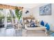 Cozy living room featuring elegant decor, bright natural light, and sliding glass doors to the patio at 4403 S Semoran Blvd # 2, Orlando, FL 32822