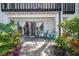 Outdoor patio with seating area, lush tropical plants, and access to the indoors at 4403 S Semoran Blvd # 2, Orlando, FL 32822