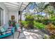 Relaxing patio with comfortable seating, surrounded by lush landscaping and greenery at 4403 S Semoran Blvd # 2, Orlando, FL 32822