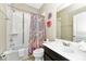 This bathroom is equipped with a shower-tub, vanity, and modern fixtures for a complete space at 4416 Acorn Ct, Davenport, FL 33837