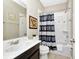 This bathroom features a shower-tub combination and sleek vanity for your convenience at 4416 Acorn Ct, Davenport, FL 33837