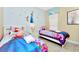 This bedroom features twin beds with an 'Elsa' theme, perfect for young Disney fans at 4416 Acorn Ct, Davenport, FL 33837