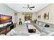 Bright living room with sliding glass doors leading to the pool area and a comfortable sectional sofa at 4416 Acorn Ct, Davenport, FL 33837