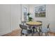 Bright dining area features hardwood floors and a round table with four chairs, perfect for a cozy meal at 4420 Lake Lawne Ave, Orlando, FL 32808