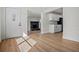 The entryway offers views of the kitchen and a living room with a fireplace, showcasing the home's open concept design at 4420 Lake Lawne Ave, Orlando, FL 32808