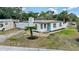Charming single-story home with a well-manicured lawn, blue door, and fresh exterior paint at 4420 Lake Lawne Ave, Orlando, FL 32808