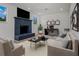 Cozy living room featuring a decorative fireplace, a modern workstation, and neutral, comfortable furniture at 4420 Lake Lawne Ave, Orlando, FL 32808