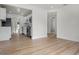 Bright living space showcasing an open concept layout with seamless flow to the kitchen with modern stainless steel appliances at 4420 Lake Lawne Ave, Orlando, FL 32808