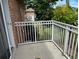 This balcony provides a view of the property's greenery and nearby building at 492 Banyon Tree Cir # 204, Maitland, FL 32751