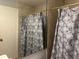 Full bathroom with stylish shower curtain at 492 Banyon Tree Cir # 204, Maitland, FL 32751