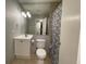 Bathroom featuring tile floors, shower with curtain, and updated sink at 492 Banyon Tree Cir # 204, Maitland, FL 32751