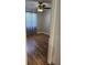 Bedroom features wood floors, ceiling fan, and window at 492 Banyon Tree Cir # 204, Maitland, FL 32751
