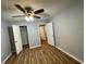 Bedroom showcasing hardwood floors and multiple closets for ample storage at 492 Banyon Tree Cir # 204, Maitland, FL 32751