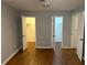 Bright bedroom featuring multiple closets and wood look floors at 492 Banyon Tree Cir # 204, Maitland, FL 32751