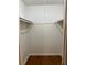 Walk-in closet providing ample storage with shelving for organization at 492 Banyon Tree Cir # 204, Maitland, FL 32751