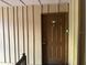 A stained front door with a door knocker and unit number '204' at 492 Banyon Tree Cir # 204, Maitland, FL 32751
