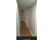 Hallway showcasing a closet with wood look flooring at 492 Banyon Tree Cir # 204, Maitland, FL 32751