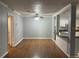 Open living room and kitchen features white cabinets, stainless steel appliances and tile floors at 492 Banyon Tree Cir # 204, Maitland, FL 32751