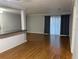 Open-concept living area featuring wood floors and modern lighting with backyard access at 492 Banyon Tree Cir # 204, Maitland, FL 32751