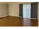 Living area featuring wood floors, neutral walls, and backyard access at 492 Banyon Tree Cir # 204, Maitland, FL 32751