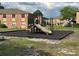 A vibrant community playground with modern equipment, safe rubber mulch, and well-maintained surroundings at 492 Banyon Tree Cir # 204, Maitland, FL 32751