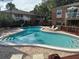 Community pool and sunbathing area nestled between residential buildings at 492 Banyon Tree Cir # 204, Maitland, FL 32751