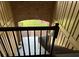 Staircase leading down from a second story apartment featuring a brick archway at 492 Banyon Tree Cir # 204, Maitland, FL 32751