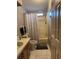 Bathroom featuring a single vanity, toilet, and a shower/tub combo with a patterned curtain at 503 Tivoli Park Dr, Davenport, FL 33897