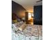 Comfortable bedroom with a large bed and decorative pillows, leading to an ensuite bathroom at 503 Tivoli Park Dr, Davenport, FL 33897