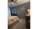 Bedroom with a ceiling fan, dresser, closet, and a comfortable bed perfect for relaxation at 503 Tivoli Park Dr, Davenport, FL 33897
