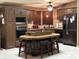 Spacious kitchen featuring an island with seating, and stainless steel appliances at 503 Tivoli Park Dr, Davenport, FL 33897