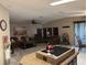 Open concept living space with kitchen island, dining area, and comfortable seating at 503 Tivoli Park Dr, Davenport, FL 33897