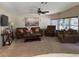 The spacious living room is carpeted and features comfortable furnishings, including multiple sofas and a coffee table at 503 Tivoli Park Dr, Davenport, FL 33897