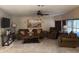 Comfortable living room with a ceiling fan, perfect for relaxation and entertainment at 503 Tivoli Park Dr, Davenport, FL 33897