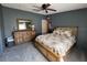 The main bedroom is carpeted and has a dresser, bed, and good natural light from the window at 503 Tivoli Park Dr, Davenport, FL 33897